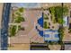 Aerial view of a home with solar panels and a basketball court in the backyard at 18131 W Palo Verde Ct, Litchfield Park, AZ 85340