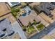 Aerial view showing the house, basketball court, and surrounding landscaping at 18131 W Palo Verde Ct, Litchfield Park, AZ 85340