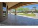 Expansive covered patio offering views of the lush landscaped backyard at 18131 W Palo Verde Ct, Litchfield Park, AZ 85340