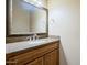 Bathroom vanity with a large mirror and granite countertop, perfect for your morning routine at 18131 W Palo Verde Ct, Litchfield Park, AZ 85340