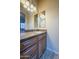 Bathroom with double vanity with granite counters and tiled flooring at 18131 W Palo Verde Ct, Litchfield Park, AZ 85340