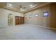 Vast bedroom offers neutral tones, tray ceilings, recessed lighting, and ample space at 18131 W Palo Verde Ct, Litchfield Park, AZ 85340