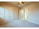 This bedroom features doors to the closet and bathroom at 18131 W Palo Verde Ct, Litchfield Park, AZ 85340