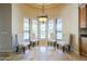 Bright breakfast nook with floor to ceiling windows provides natural light and views to the backyard at 18131 W Palo Verde Ct, Litchfield Park, AZ 85340