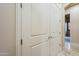 Hallway closet with double doors for ample storage at 18131 W Palo Verde Ct, Litchfield Park, AZ 85340