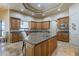Gourmet kitchen boasts a large island, custom cabinets, and granite countertops at 18131 W Palo Verde Ct, Litchfield Park, AZ 85340