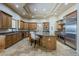 Spacious gourmet kitchen with stainless steel appliances and kitchen island at 18131 W Palo Verde Ct, Litchfield Park, AZ 85340