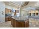 Open gourmet kitchen with stainless steel appliances and granite countertops at 18131 W Palo Verde Ct, Litchfield Park, AZ 85340