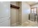 Bright laundry room featuring cabinets and a modern washer/dryer at 18131 W Palo Verde Ct, Litchfield Park, AZ 85340