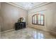 Formal living room with chandelier, wooden shuttered windows, and travertine floor at 18131 W Palo Verde Ct, Litchfield Park, AZ 85340