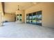 Covered patio with ceiling fans overlooking the manicured backyard at 18131 W Palo Verde Ct, Litchfield Park, AZ 85340