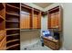 A large walk-in closet provides ample storage with built-in shelving and a monitoring station at 18131 W Palo Verde Ct, Litchfield Park, AZ 85340