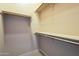 Spacious walk-in closet with multiple rods and shelves for optimal storage organization at 18131 W Palo Verde Ct, Litchfield Park, AZ 85340