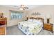 Serene bedroom with a comfortable bed, ceiling fan, and peaceful ambiance at 18655 N Palomar Dr, Sun City West, AZ 85375