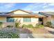Charming single-story home featuring well-maintained landscaping and neutral color scheme at 18655 N Palomar Dr, Sun City West, AZ 85375