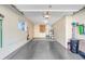 Organized garage with ample storage cabinets and a clean, well-maintained floor at 18655 N Palomar Dr, Sun City West, AZ 85375
