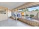 Enclosed patio with brick siding, offering a versatile space for relaxation and outdoor enjoyment at 18655 N Palomar Dr, Sun City West, AZ 85375