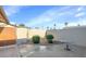 Private patio area with stone accents and a seating arrangement for outdoor relaxation at 18655 N Palomar Dr, Sun City West, AZ 85375