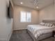 Cozy bedroom with a ceiling fan, carpeted floors, and a window with plantation shutters at 19139 N 260Th Ave, Buckeye, AZ 85396