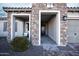 Covered entry with stone accents offers a welcoming space into the home at 19139 N 260Th Ave, Buckeye, AZ 85396