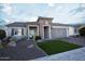 Home exterior with well-manicured desert landscaping and stone facade at 19139 N 260Th Ave, Buckeye, AZ 85396