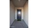 The home's attractive front door features a keyless entry system at 19139 N 260Th Ave, Buckeye, AZ 85396