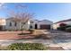 Charming single-story home with desert landscaping, a two-car garage, and a welcoming front entrance at 20477 W Ridge Rd, Buckeye, AZ 85396