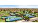 Beautiful aerial view of tennis and pickleball courts and putting greens at 20934 N Sweet Dreams Dr, Maricopa, AZ 85138