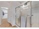 Bathroom shower with glass doors, and towel rack at 20934 N Sweet Dreams Dr, Maricopa, AZ 85138