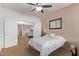 Neutral bedroom with ceiling fan, closet, and carpeted floors at 20934 N Sweet Dreams Dr, Maricopa, AZ 85138