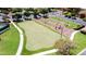 Scenic aerial shot of bocce ball court with lush green lawns and inviting landscaping at 20934 N Sweet Dreams Dr, Maricopa, AZ 85138