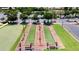 Scenic aerial shot of well-kept bocce ball court and surrounding green spaces at 20934 N Sweet Dreams Dr, Maricopa, AZ 85138