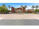 A grand entrance to the clubhouse with palm trees and a central fountain at 20934 N Sweet Dreams Dr, Maricopa, AZ 85138