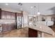 Spacious kitchen with stainless steel appliances, granite countertops and ample cabinet storage at 20934 N Sweet Dreams Dr, Maricopa, AZ 85138