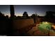 Inviting backyard pool with lush desert landscaping, perfect for relaxing evenings at 20934 N Sweet Dreams Dr, Maricopa, AZ 85138
