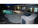 Backyard pool with mature landscaping, outdoor kitchen, and covered patio perfect for outdoor entertaining at 20934 N Sweet Dreams Dr, Maricopa, AZ 85138