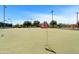 Landscaped putting green featuring hole number 13 in a well-maintained community at 20934 N Sweet Dreams Dr, Maricopa, AZ 85138