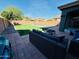 Inviting backyard with lush artificial turf, a pool, and comfortable outdoor seating area at 21868 S 215Th St, Queen Creek, AZ 85142