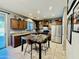 The kitchen area boasts stainless steel appliances, gorgeous counters, tile flooring, and a center island at 21868 S 215Th St, Queen Creek, AZ 85142