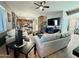 Spacious living room is perfect for Gathering time with a cozy sitting arrangement and ceiling fan at 21868 S 215Th St, Queen Creek, AZ 85142