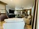 Spacious living room boasts tile flooring, ceiling fan and comfortable seating at 21868 S 215Th St, Queen Creek, AZ 85142