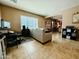 Bright living area with a desk, tile flooring, and comfortable neutral seating at 21868 S 215Th St, Queen Creek, AZ 85142