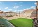 Large backyard with artificial turf, low maintenance landscaping, and a relaxing atmosphere at 22714 N Chase Dr, Maricopa, AZ 85138