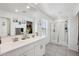 Spacious bathroom with double vanity, modern fixtures, and a glass-enclosed shower at 22714 N Chase Dr, Maricopa, AZ 85138