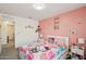 bedroom with playful theme, bedside table, and plenty of natural light at 22714 N Chase Dr, Maricopa, AZ 85138