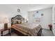 This bedroom features a decorative headboard and detailed bedding for a cozy, inviting space at 22714 N Chase Dr, Maricopa, AZ 85138