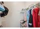 This closet features ample storage with shelving, a hanging rack, and plenty of space for organization at 22714 N Chase Dr, Maricopa, AZ 85138