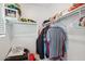 Spacious walk-in closet with ample shelving and hanging space for organized storage at 22714 N Chase Dr, Maricopa, AZ 85138