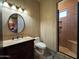 Bathroom with dark vanity, toilet and walk in shower at 25572 N 113Th Way, Scottsdale, AZ 85255