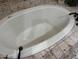 Elegant soaking tub with jets surrounded by tile flooring at 25572 N 113Th Way, Scottsdale, AZ 85255
